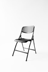 Modern black chair isolated on white background. High quality vertical photo