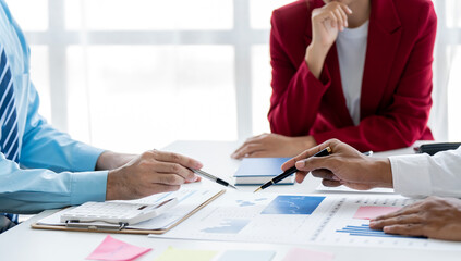 Businessman team working at office with document on his desk, doing planning analyzing the financial report, business plan investment, finance analysis concept.