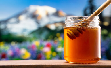 Jar of honey on nature background