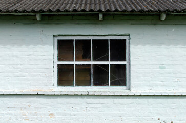 Fototapeta na wymiar Brick wall of a building with window