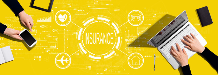 Insurance concept with two people working together