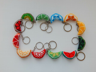 Colorful fruit key chains on a white