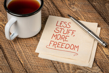 less stuff, more freedom - inspirational handwriting on a napkin, decluttering and minimalism...