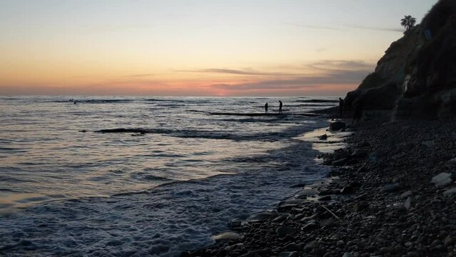 Couple on beach -  Silhouette - Pacific sunset Swamis Point Reef Encinitas California #5.