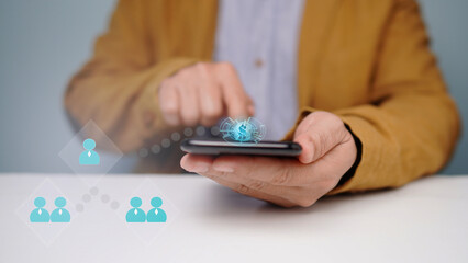 man pointing finger at smartphone on table There is an empty space on the left. (blur or berry)