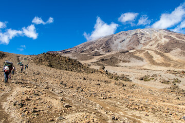 Scenery, rock piles and hiking trail on the slope of Mount Kilimanjaro