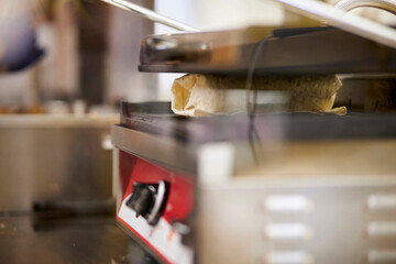 the cook fries shawarma. Cooking shawarma. grill fries shawarma. shawarma. street food, fast real life. close-up, soft focus