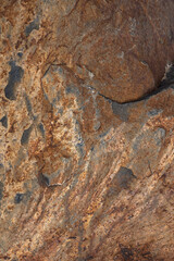 old rock background, strong texture of redish grey stone