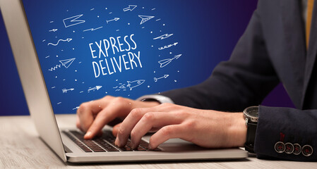 Obraz na płótnie Canvas Businessman working on laptop, e-commerce concept