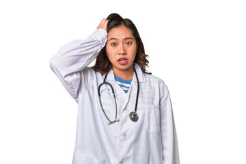 A young asian doctor woman being shocked, she has remembered important meeting.