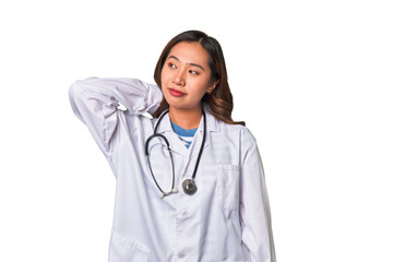 A young asian doctor woman touching back of head, thinking and making a choice.