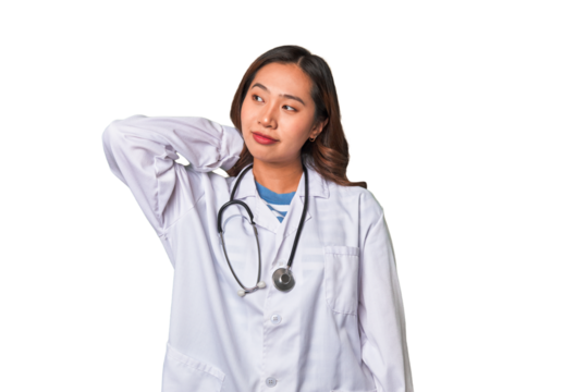 A young asian doctor woman touching back of head, thinking and making a choice.