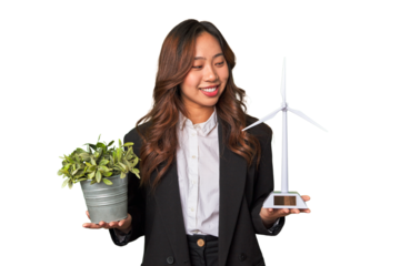 A powerful Chinese businesswoman holds a thriving plant and a windmill model, symbolizing her commitment to sustainable and responsible business practices.