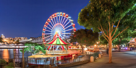 The sun sets over the iconic Luna Park in Milsons Point, NSW, casting a warm glow over Glen Street. - generative ai.