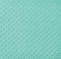 Texture of green sponge for kitchen and home on white isolated background