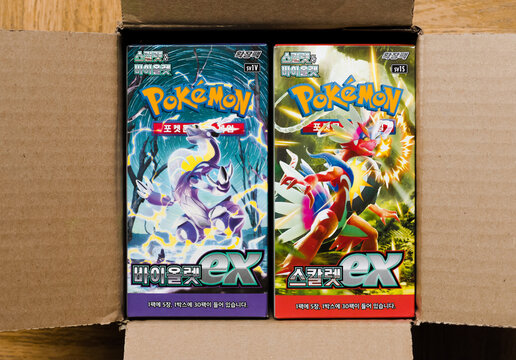 Hamburg, Germany - 04082023: photo of two sealed korean pokemon Displays of violet&scarlet ex in paper box. Card collectors are now investing in Korean cards because Japanese cards are too expensive.