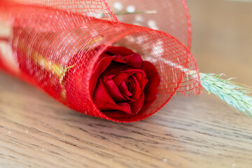 Red rose and electronic book to celebrate Sant Jordi day, April 23