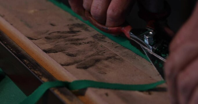 billiard table repairman at work