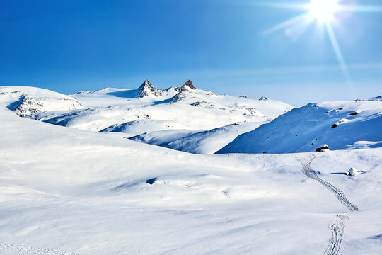 East Greenland landscape with mountains and sun