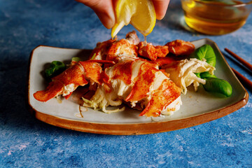 Fresh lobster is cooked perfectly in our gourmet dinner kitchen served with lemon making it delicious ocean food meal