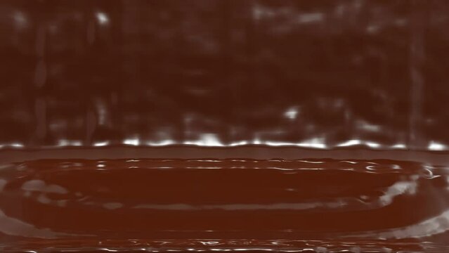 Liquid hot milk chocolate is pouring on a lilac background. Abstract animation