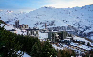 Residential buildings in the center of Les Ménuires ski resort in the French Alps in winter