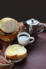 Brazilian breakfast. Coffee cup and slice bread with butter.