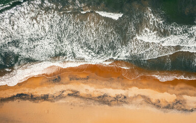 Aerial view of ocean waves on the shore of Sri Lanka