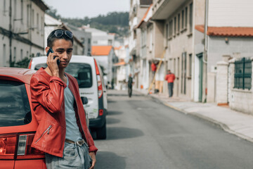 Fototapeta premium urban young man in the street with mobile phone