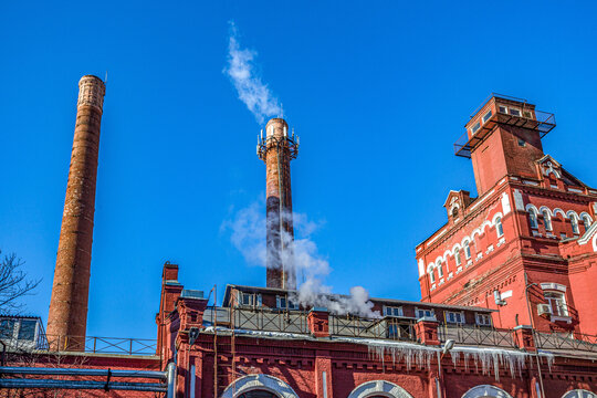 Industrial buildings and chimneys of an old red brick factory in Moscow