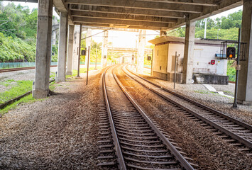 Fototapeta na wymiar Train station track with sunset view - transport concept