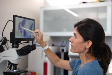 veterinarian by touching the digital display of the microscope.