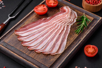 Delicious fresh pancetta with salt and spices cut into thin slices