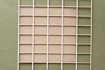 wood lattice and scrapbook paper on green