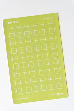 cricut cutting mat - standard grip - grungy with various cut lines - lacking stickiness but still coated with grungy material