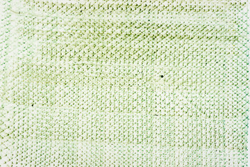 frottage technique featuring a grid or net pattern on tracing paper and photographed on a white...