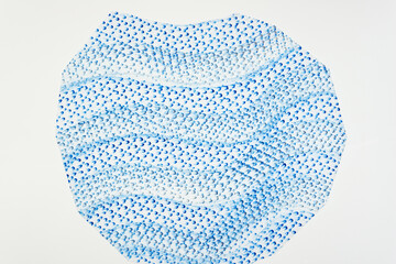frottage technique featuring a grid or net pattern on tracing paper and photographed on a white backlit surface