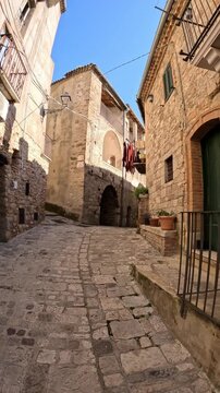 A narrow street among the old houses of Civitacampomarano, a medieval town in the province of Campobasso in Italy.
