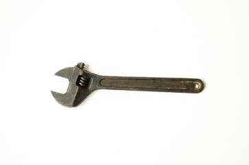 Metal adjustable wrench for plumbing and construction work on a white isolated background.  Flat lay, top view.
