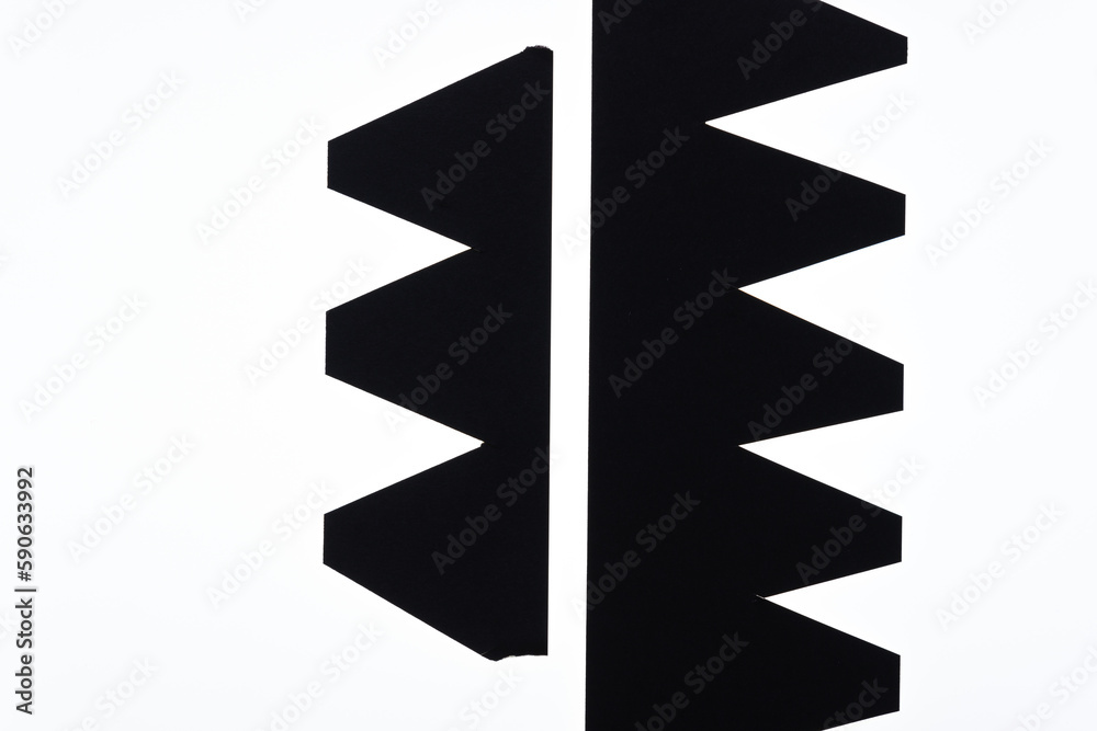 Wall mural black paper shapes with arrow or zig zag pattern on a white background