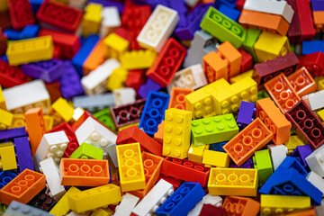 Bunch of colorful kids toy bricks in a pit