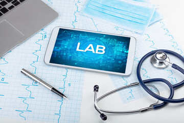 Close-up view of a tablet pc with medical abbreviation