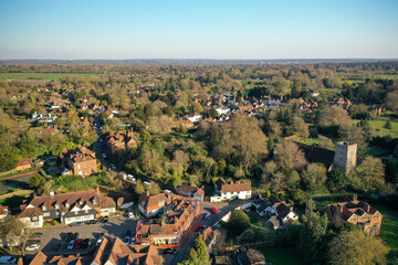 Fototapeta premium flying over around pretty country side , trees and houses aerial drone photo