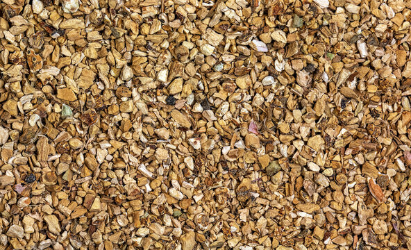 Background of organic dry calamus root. The Latin name is Acorus calamus. Close-up of background texture. Top view. The concept of herbal treatment.