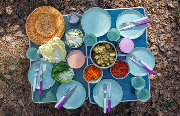 Table with pasuda for a picnic in nature