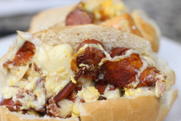 sausage and cheese sandwich. bread with cheese and sausage. dairy pork sandwich texture. sandwich with selective focus.
