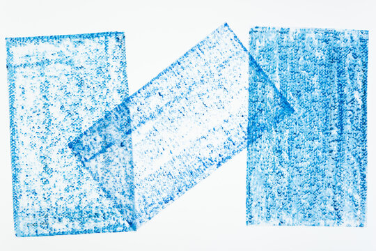 frottage of canvas board on tissue paper and photographed on a white background