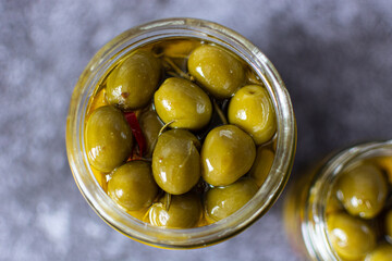 green olives in a glass jar
