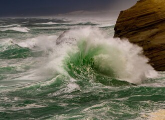 Giant waves as they crash into the headlands at Cape Kiwanda, north Oregon coast at Pacific City.
