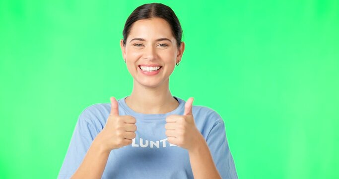 Happy woman, volunteer and hands in thumbs up on green screen for agreement or success against a studio background. Portrait of female showing thumb emoji, yes sign or like for good job on mockup